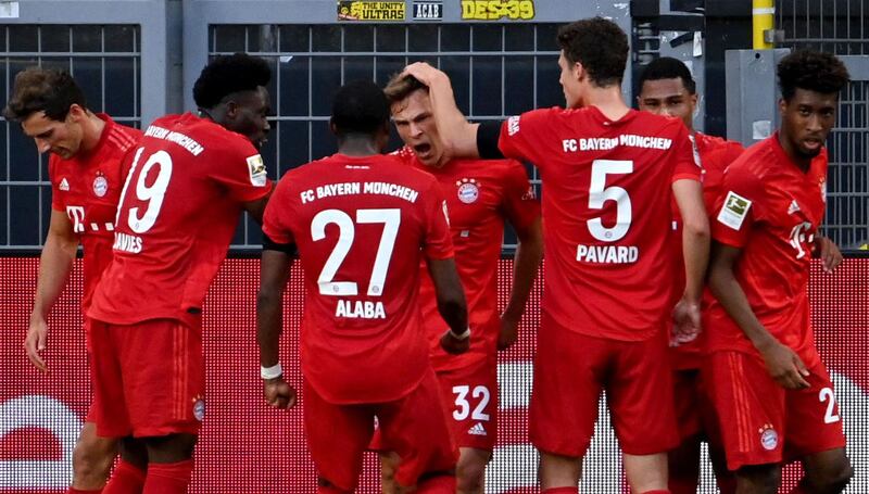 Bayern Munich players celebrate with Joshua Kimmich. AFP