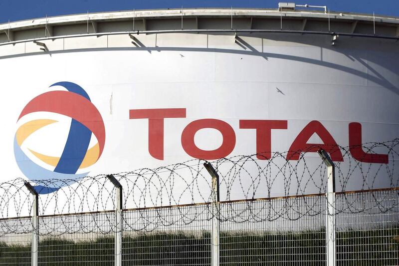 Total's production tumbled by 10 per cent to 2 million barrels of oil equivalent a day. Charles Platiau / Reuters