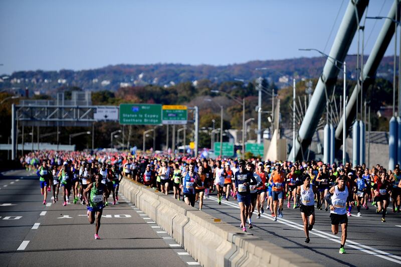 NEW YORK, NEW YORK - NOVEMBER 03: Participants of the TCS New York City Marathon run over the Verrazzano Bridge at the start of the race on November 03, 2019 in the Staten Island borough of New York City.   Emilee Chinn/Getty Images/AFP