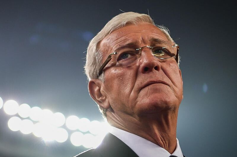 (FILES) This file picture taken on November 10, 2017 shows China's coach Marcello Lippi looking on during an international friendly football match against Serbia National Team at Tianhe Sports Centre Stadium in Guangzhou in China's southern Guangdong province.  China and India together account for nearly half of the world's population, but when it comes to football they are minnows often beaten by countries a fraction of their size.Their struggles will be laid bare on October 13, 2018 when China host their Asian rivals in a friendly that the home side are in particular under huge pressure to win, and win well. - China OUT / TO GO WITH AFP STORY:  Fbl-Asia-CHN-IND by Peter STEBBINGS with Faisal KAMAL
 / AFP / STR / TO GO WITH AFP STORY:  Fbl-Asia-CHN-IND by Peter STEBBINGS with Faisal KAMAL
