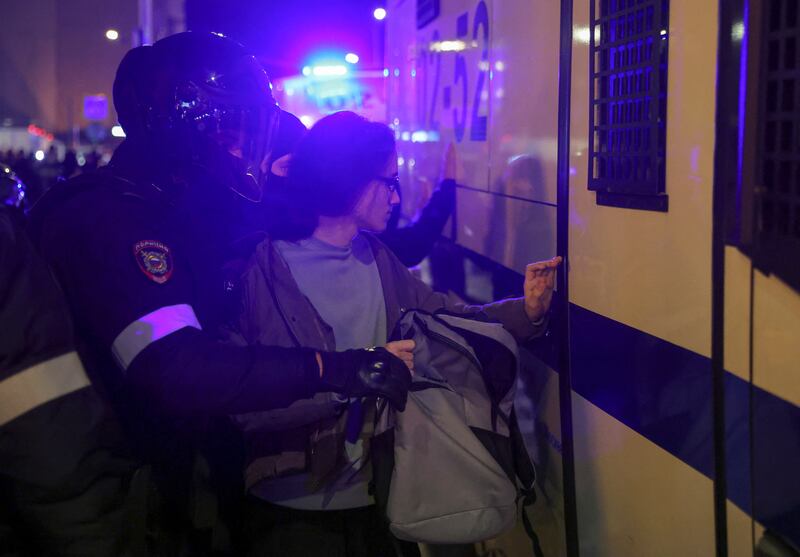 Russian police officers detain a protester. Reuters