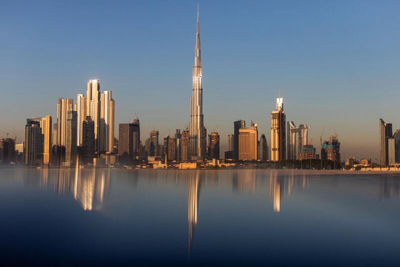 The Burj Khalifa skyscraper, center, stands above other skyscrapers on the city skyline in Dubai, United Arab Emirates, on Tuesday, Dec. 24, 2019. Dubai’s spending will surge next year as it prepares for World Expo 2020, according to the budget the government approved on Sunday. Photographer: Christopher Pike/Bloomberg