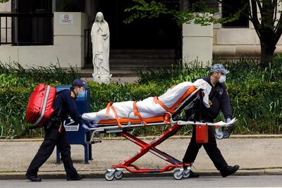 epaselect epa08412461 A patient is transported from the Terence Cardinal Cooke health care center on the upper east side in New York, New York, USA, 09 May 2020. New York remains the epicenter of the coronavirus Covid-19 outbreak in the USA.  EPA/Peter Foley