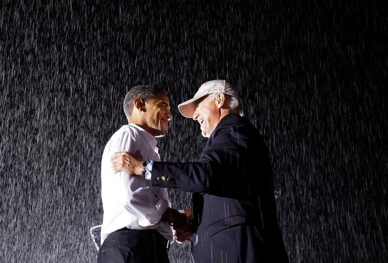 Democratic presidential candidate Sen. Barack Obama D-Ill., shakes hands with democratic vice presidential candidate Sen. Joe Biden, D-Del., at a rally in the rain at the University of Mary Washington in Fredericksburg, Va., Saturday, Sept. 27, 2008. (AP Photo/Alex Brandon)