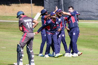 USA bowler Ian Holland celebrates the wicket of Muhammad Waseem. Peter Della Penna / Cricket Scotland