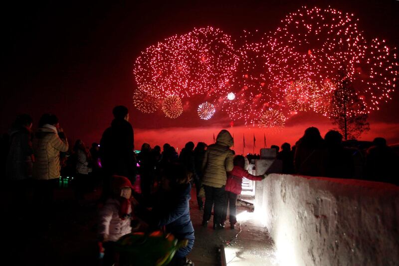 North Koreans watch as fireworks explode as part of New Year celebrations, above the Taedong River as viewed from Kim Il Sung Square, in Pyongyang, North Korea. Jon Chol Jin / AP Photo