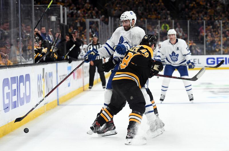 Apr 13, 2019; Boston, MA, USA; Boston Bruins defenseman Matt Grzelcyk (48) hits Toronto Maple Leafs center Nazem Kadri (43) during the third period in game two of the first round of the 2019 Stanley Cup Playoffs at TD Garden. Mandatory Credit: Bob DeChiara-USA TODAY Sports
