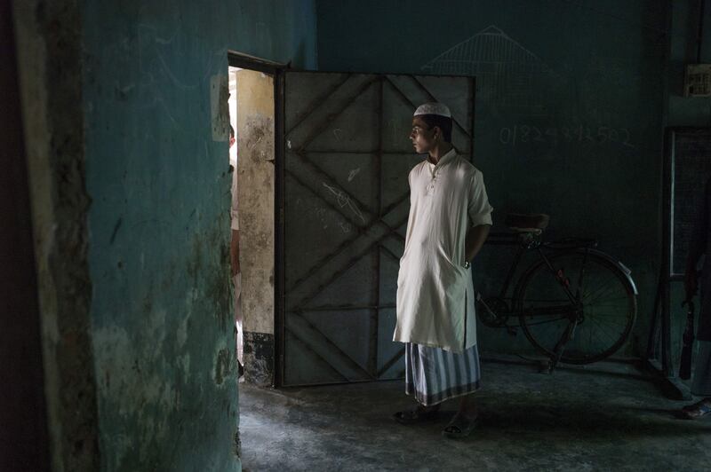 A Bangladeshi man stands in a room where bodies of Rohingya Muslim refugees are being brought on Shah Porir Dwip Island near Teknaf on October 9, 2017, after a boat capsizing accident. Fred Dufour / AFP