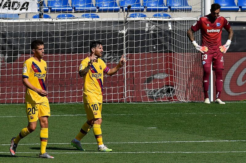 Barcelona's Lionel Messi, centre, celebrates his goal against Alaves. AP Photo