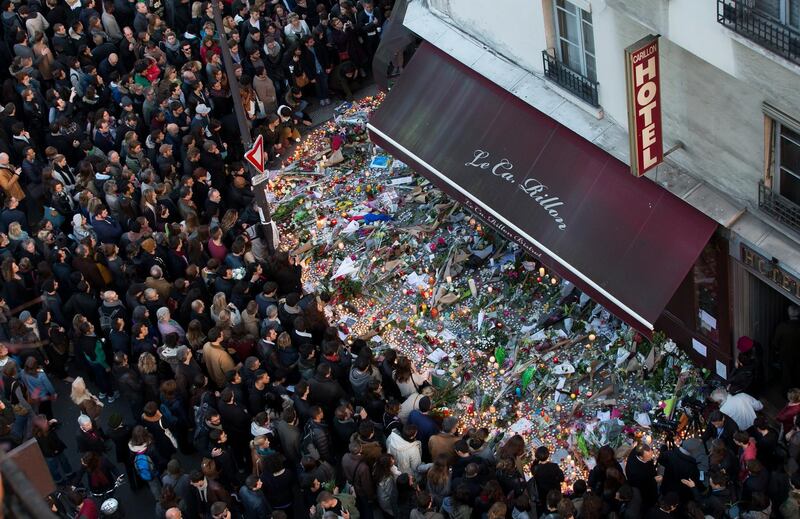 A large crowd gathered to lay flowers and candles for the victims after 130 people were killed and hundreds injured in the terror attacks. EPA