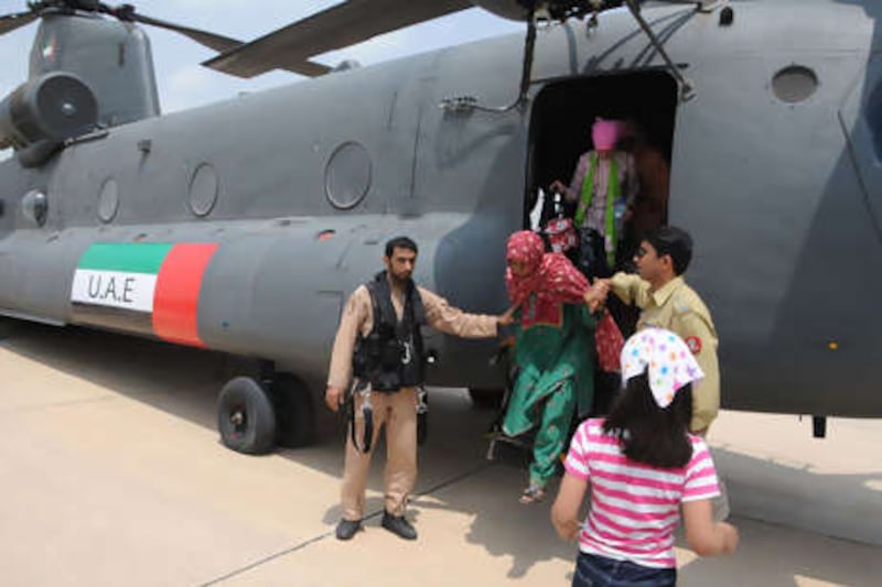 A UAE Armed Forces helicopter ferries aid to flooded regions of Pakistan as part of relief operations. Wam