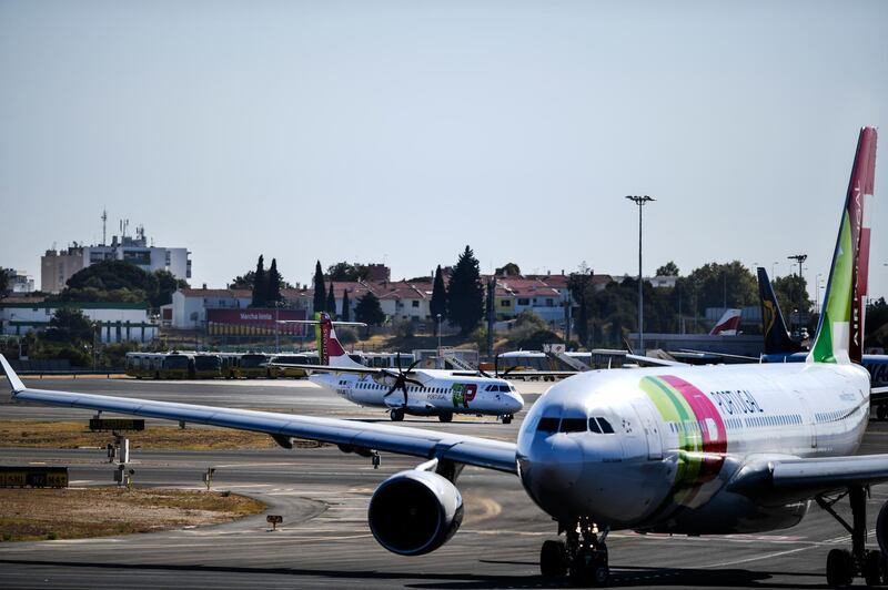 Planes of Portuguese airline TAP are pictured at Humberto Delgado airport in Lisbon on October 3, 2018. (Photo by PATRICIA DE MELO MOREIRA / AFP)
