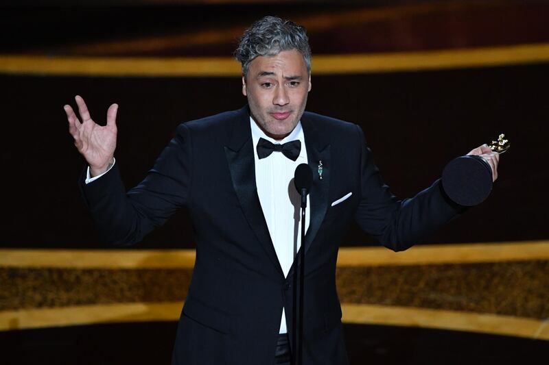 (FILES) In this file photo New Zealand director/actor Taika Waititi accepts the award for Best Adapted Screenplay for "Jojo Rabbit" during the 92nd Oscars at the Dolby Theatre in Hollywood, California on February 9, 2020. New Zealand filmmaker Taika Waititi will write and direct a new "Star Wars" film, Disney announced May 4, 2020. Waititi has shot from indie acclaim to mainstream Hollywood success in recent years, overseeing Marvel superhero smash hit "Thor: Ragnarok" in 2017 before winning a screenplay Oscar for Nazi satire "Jojo Rabbit" in February.
 / AFP / Mark RALSTON
