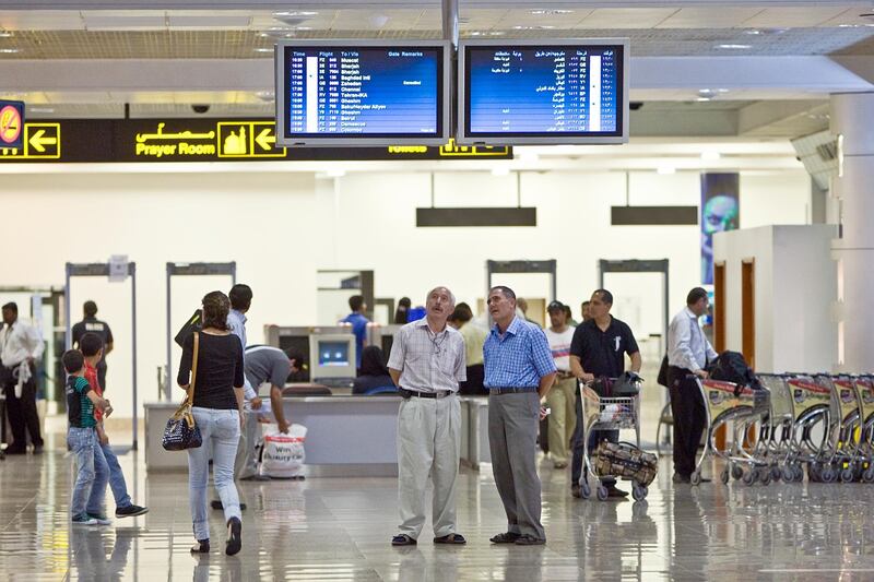 United Arab Emirates - Dubai - August 2, 2010.

BUSINESS: Passengers check their flight schedules at Dubai International Airport Terminal 2 in Dubai on Monday, August 2, 2010. Amy Leang/The National