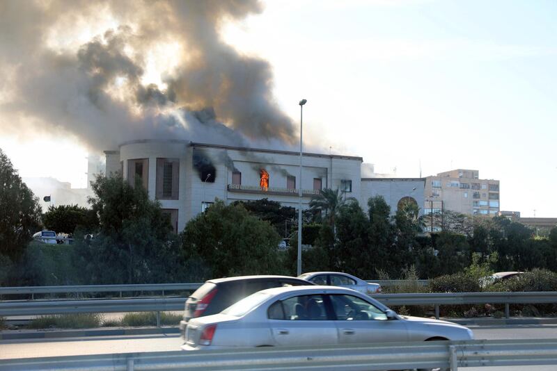 Smoke rises from the site of the headquarters of Libya's foreign ministry after suicide attackers hit in Tripoli. Reuters