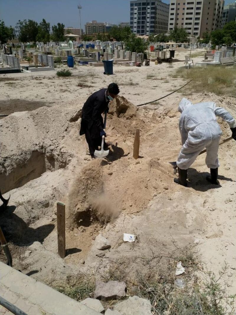  Volunteers dig a grave at a cemetery in Dubai's Al Raffa area. Courtesy: Rehan Ali