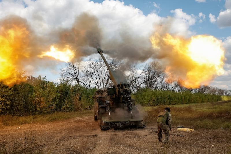 A Ukrainian soldier fires a howitzer towards Russian troops in Donetsk region. Reuters