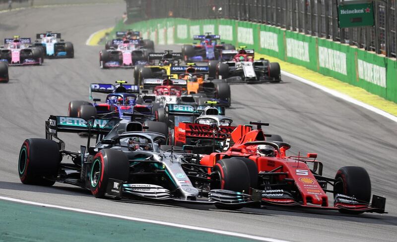 Sebastian Vettel and Lewis Hamilton tussle during the 2019 Brazilian Grand Prix. Reuters