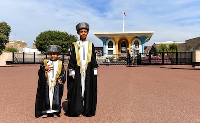 Omani boys pose for a picture while dressed in traditional costume outside Al-Alam ceremonial in the capital Muscat on November 17, 2018, on the eve of the Sultanate’s 48th National Day. (Photo by GIUSEPPE CACACE / AFP)