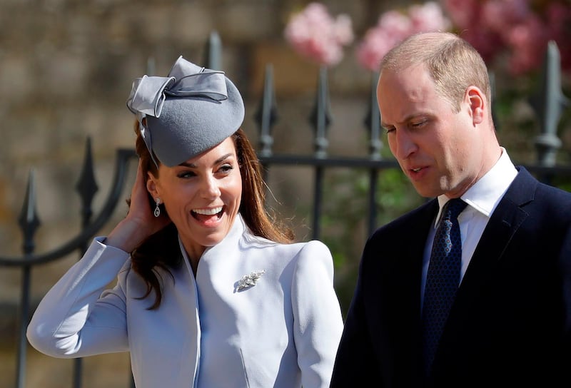 Britain's Catherine, Duchess of Cambridge (L) smiles as she and Britain's Prince William, Duke of Cambridge arrrive for the Easter Mattins Service at St. George's Chapel, Windsor Castle. Britain's Queen Elizabeth II celebrates her birthday on Sunday, marking 93 years in the public glare.  AFP