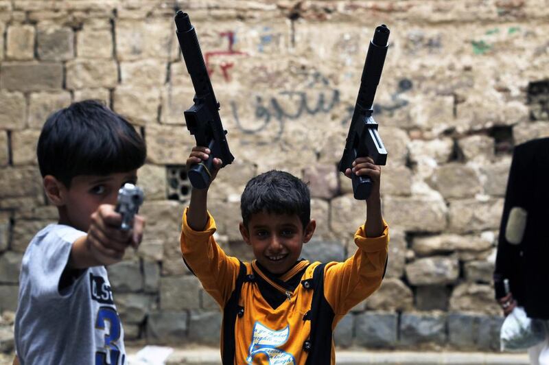 Yemeni children pose with toy guns they got as a gift for Eid Al Fitr, during the Muslim festival of Eid Al Fitr in the narrow streets of the old city of Sana’a, Yemen. Yahya Arhab / EPA