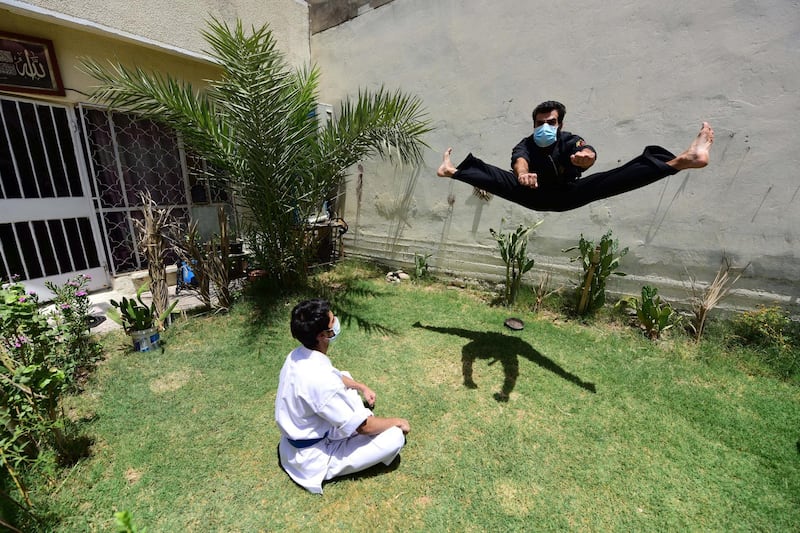 Iraqi Karate-coach Asif Mohamed (right) gives a Karate lesson to a young man it his house in Baghdad, Iraq. All training centers for Karate are closed in Baghdad.  EPA