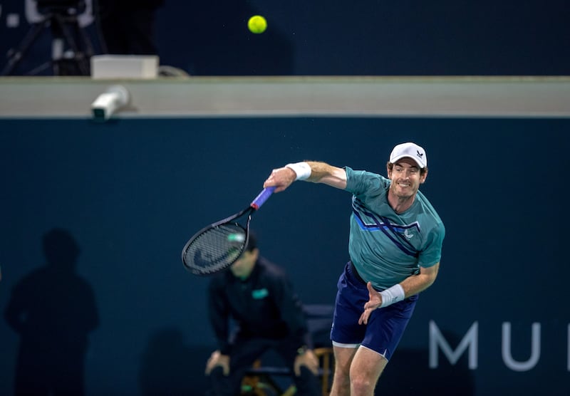 Andy Murray serves to Dan Evans at the Mubadala World Tennis Championship. Victor Besa / The National