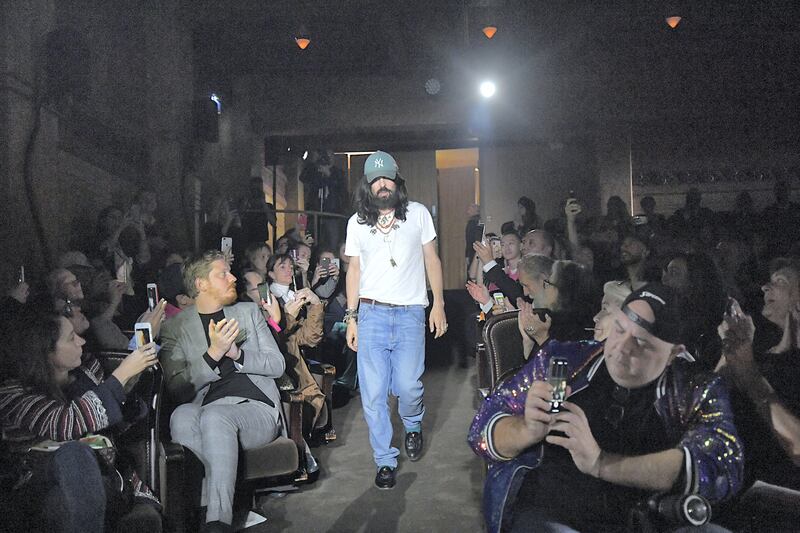 PARIS - SEPTEMBER 24: Gucci designer Alessandro Michele strides through the audience after presenting his spring / summer 2019 fashion show. (Photo by Jonas Gustavsson/MCV Photo For The Washington Post via Getty Images)