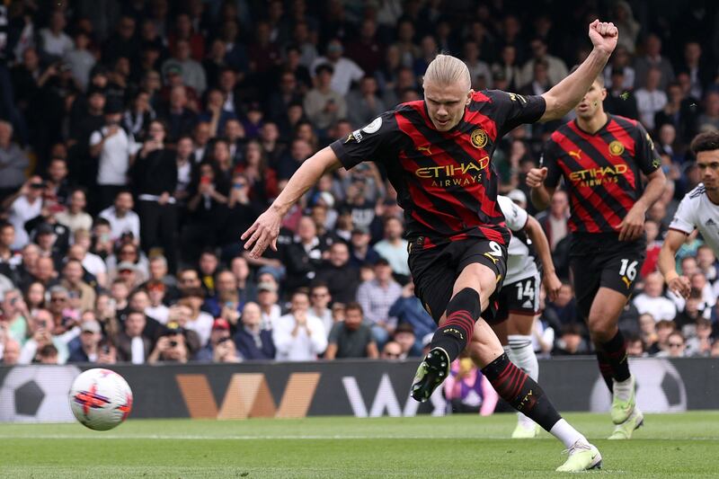 Erling Haaland fired home from the penalty spot to score Manchester City's first goal in their 2-1 Premier League win over Fulham at Craven Cottage on April 30, 2023. AFP
