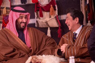Japan's Prime Minister Shinzo Abe wears a traditional costume as he meets with Saudi Arabia's Crown Prince Mohammed bin Salman in Riyadh, Saudi Arabia January 12, 2020. Picture taken January 12, 2020. Bandar Algaloud/Courtesy of Saudi Royal Court/Handout via REUTERS ATTENTION EDITORS - THIS PICTURE WAS PROVIDED BY A THIRD PARTY