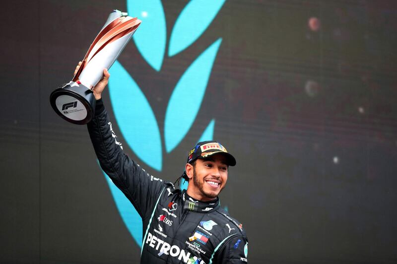 British driver Lewis Hamilton celebrates his seventh F1 world title. AFP