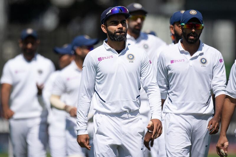 India's captain Virat Kohli walks from the field with his team after losing the match to New Zealand in Wellington. AFP