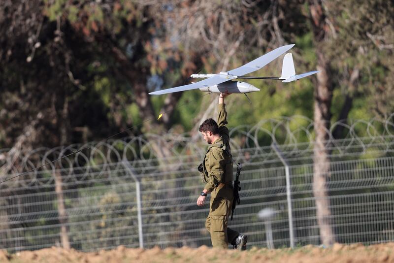 Israeli soldiers prepare to launch a drone along the border with Gaza. AFP
