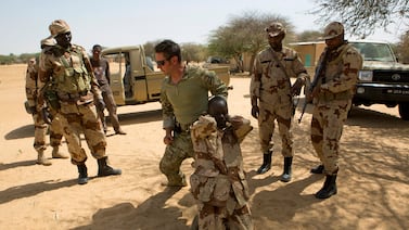 A US special forces soldier demonstrates how to detain a suspect during a mission for African militaries in Niger. Reuters