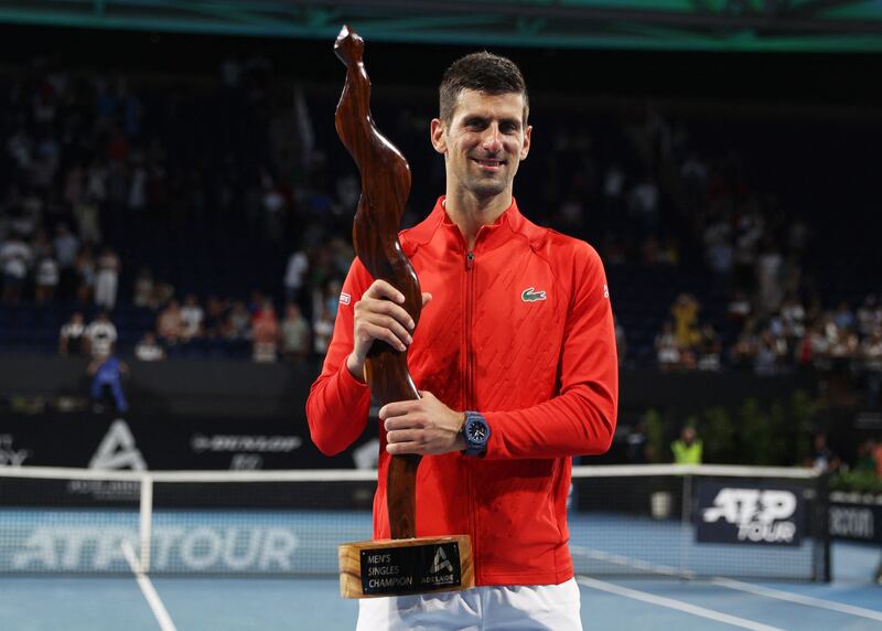 Novak Djokovic celebrates with the Adelaide International trophy after winning the final against Sebastian Korda at Memorial Drive Tennis Club in Adelaide, Australia, on January 8, 2023. Reuters