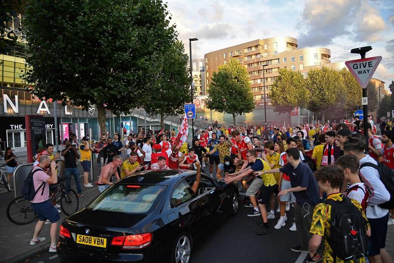 Arsenal fans celebrate outside the Emirates stadium. AFP