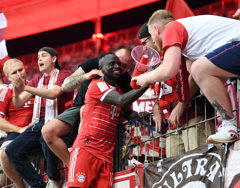 Sadio Mane celebrates with fans after Bayern Munich's 6-1 Bundesliga win over Eintracht Frankfurt on August 5, 2022. AFP