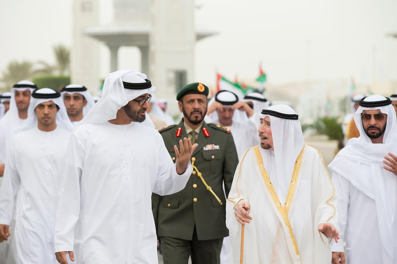 ABU DHABI, UNITED ARAB EMIRATES - August 08, 2013: HH General Sheikh Mohamed bin Zayed Al Nahyan Crown Prince of Abu Dhabi Deputy Supreme Commander of the UAE Armed Forces (center L), speaks with Imam, Ali Al Hashmi (center R), after attending a morning prayer at the Sheikh Zayed Grand Mosque, on the occasion of Eid Al-Fitr. Seen with HH Sheikh Mansour bin Zayed Al Nahyan Deputy Prime Minister and Minister of Presidential Affairs (back L), and HH Sheikh Hamdan bin Zayed Al Nahyan Deputy Prime Minister and Ruler of the Western Region (R). 
( Ryan Carter / Crown Prince Court - Abu Dhabi )
---