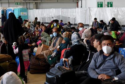 Afghan refugees are processed inside Hangar 5 at Ramstein, the largest US air base in Europe. AP 
