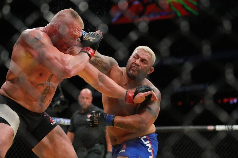 Mark Hunt punches Brock Lesnar during the UFC 200 event at T-Mobile Arena on July 9, 2016 in Las Vegas, Nevada. Rey Del Rio / Getty Images