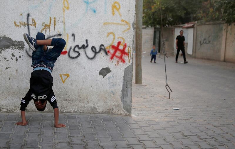 A Palestinian boy during the dance training in Al-Nusairat refugee camp, central Gaza Strip. In 2012 Ahmed and his friends established a dance school in the Nuseirat refugee camp and where approximately 60 trainees ranging in age from 6 to 20 years , Tuesday, Nov. 5, 2019. (AP Photo/ Hatem Moussa)
