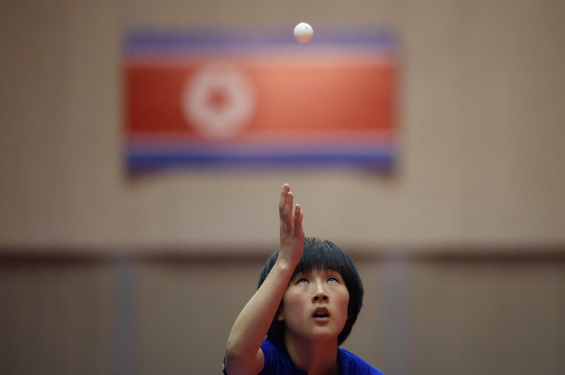 In a photo taken on June 17, 2018 a table tennis player from North Korea serves during a match of the Pyongyang Open annual International Table Tennis Federation (ITTF) match in Pyongyang. North Korean sports administrators are hoping the country will come in from the sporting cold in the wake of leader Kim Jong Un's summit with Donald Trump in Singapore.
 / AFP / Ed JONES
