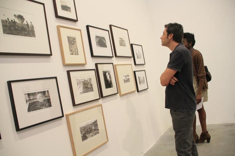 Visitors admire work at last year’s inaugural Quoz Happens, the annual arts and culture festival in the Al Quoz area of Dubai. Courtesy Alserkal Avenue