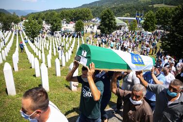 Men carry the coffin of a Srebrenica massacre victim at the memorial cemetery in Potocari, Bosnia and Herzegovina, on July 11, 2020. Reuters