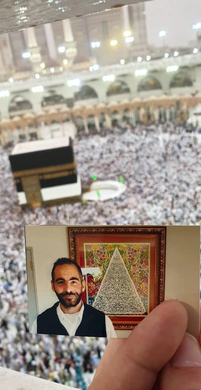 A photo of Hussein Al Umari, a victim of the Christchurch mosques shootings, carried by his sister Aya while performing Umrah for her brother. Courtesy of Aya Al Umari