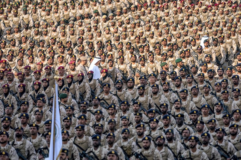 Sheikh Mohamed inspects military personnel.