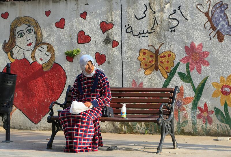 A woman sits on a bench, during a countrywide lockdown to prevent the spread of the coronavirus disease in Sidon, Lebanon. Reuters