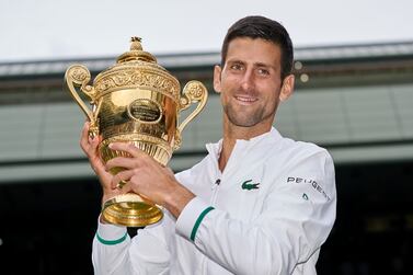 FILE PHOTO: Jul 11, 2021; London, United Kingdom; Novak Djokovic (SRB) holds the trophy after beating Matteo Berrettini (ITA) in the men?s final  on Centre Court at All England Lawn Tennis and Croquet Club.  Mandatory Credit: Peter van den Berg-USA TODAY Sports / File Photo