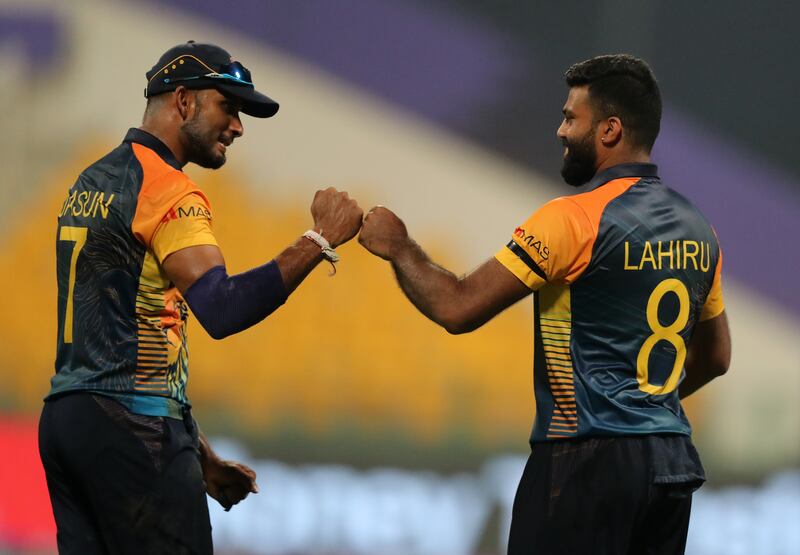 Sri Lanka's Lahiru Kumara first bumps captain Dasun Shanaka after taking the wicket of Namibia batsman Pikky Ya France. Chris Whiteoak