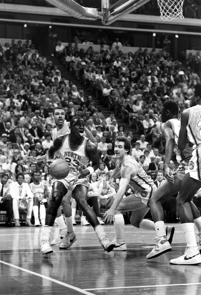 North Carolina's Michael Jordan (23) drives around Clemson's Marc Campbell during first round ACC Tournament action at the Omni in Atlanta, Ga., Friday, March 11, 1983.  (AP Photo)